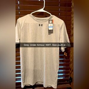 New with tags. Under Armour, gray shirt. Size youth extra large.
